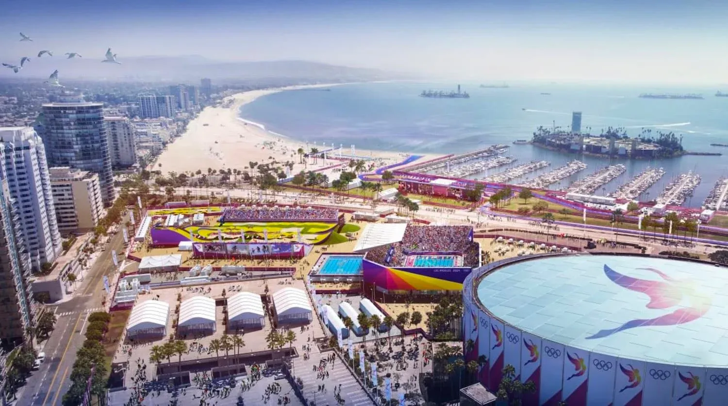 An aerial view of sports facilities near the ocean.