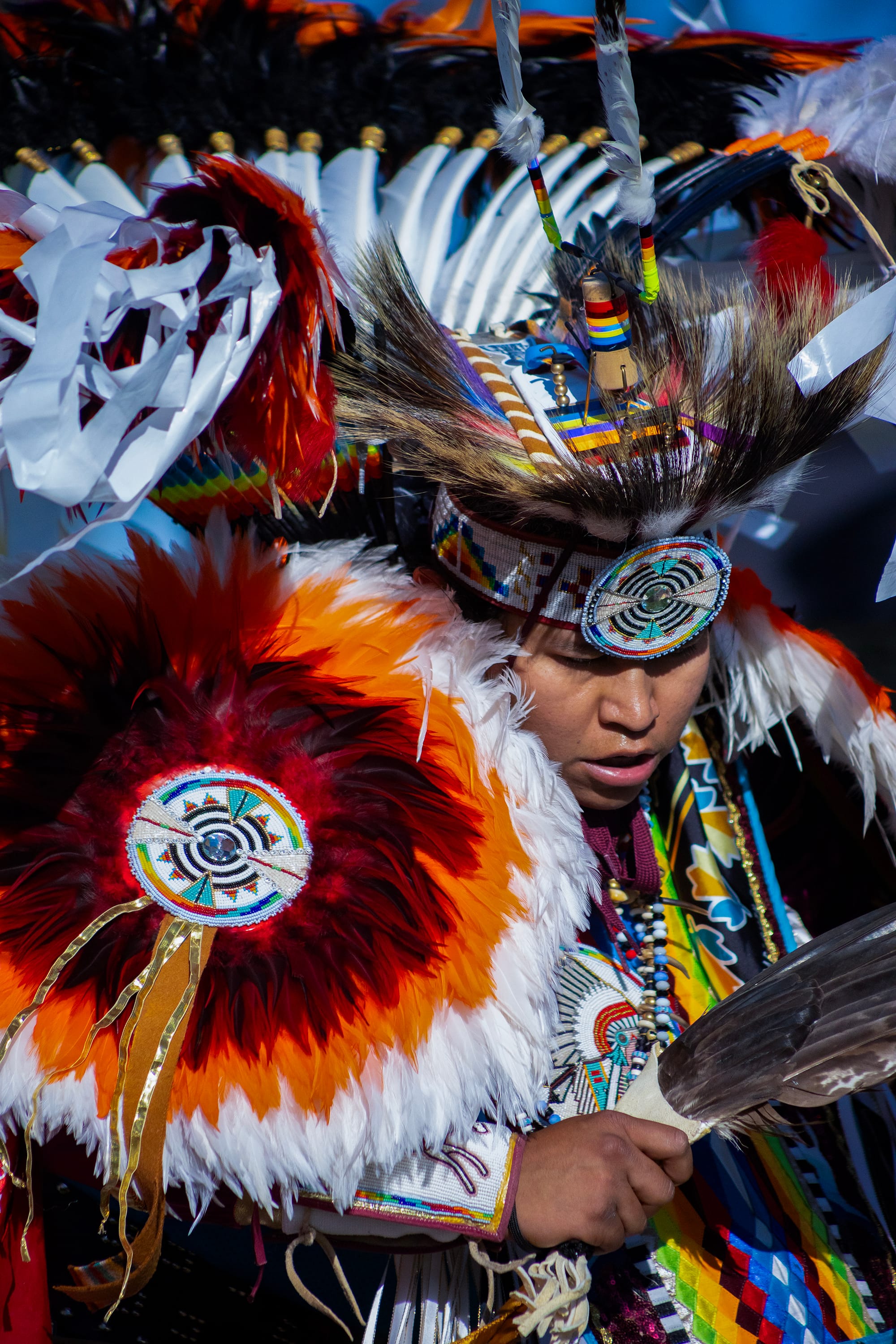 A person in colorful Native American clothing.