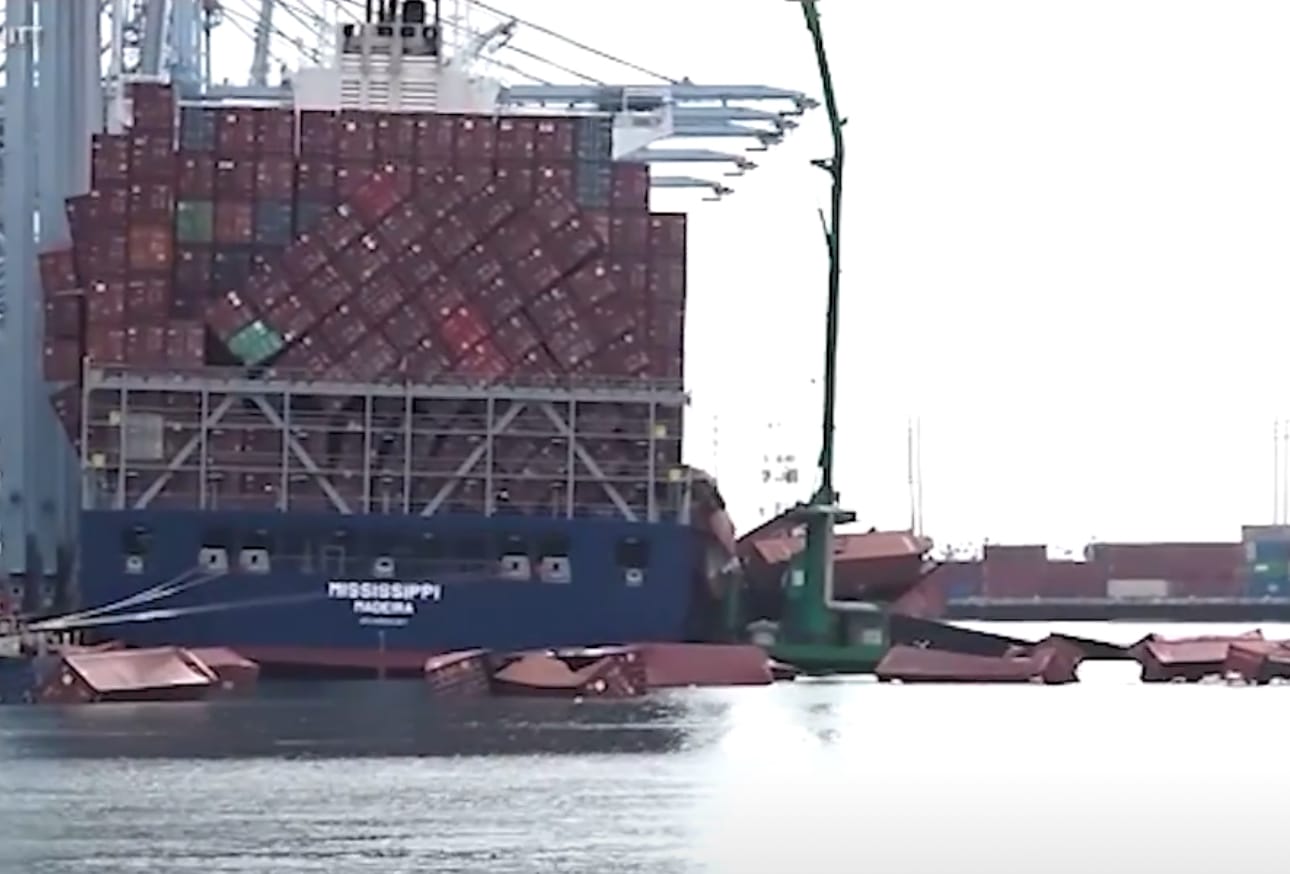 Containers floating around a freighter.