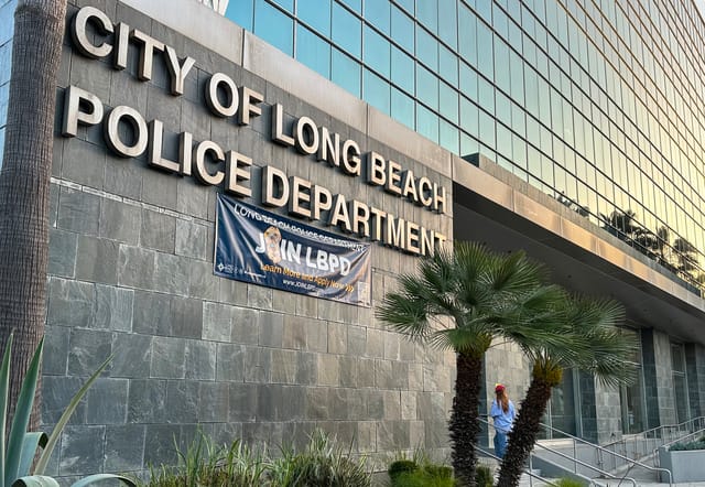 Gray office building with the words City of Long Beach Police Department on the side.