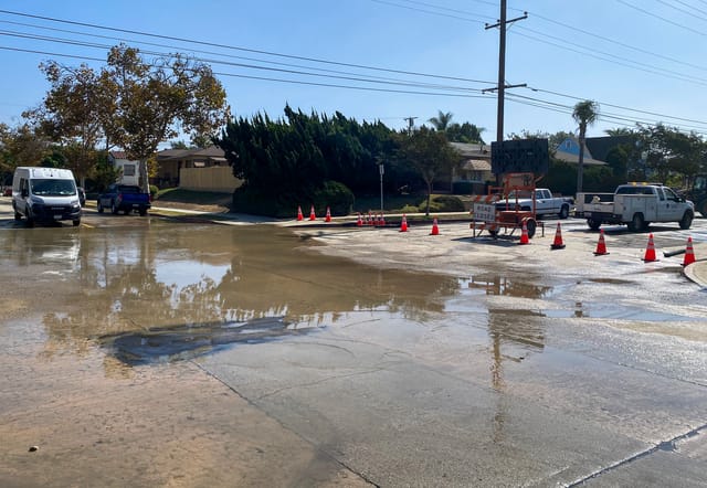 Water floods a street.