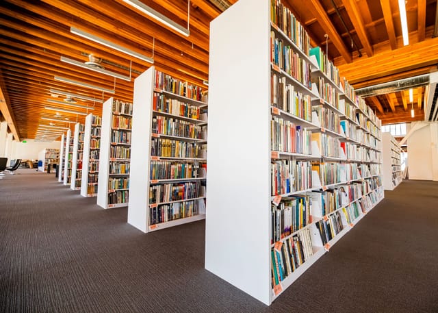 Rows of library book shelves