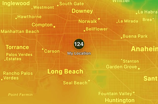 An orange and yellow map showing air quality levels in different cities.