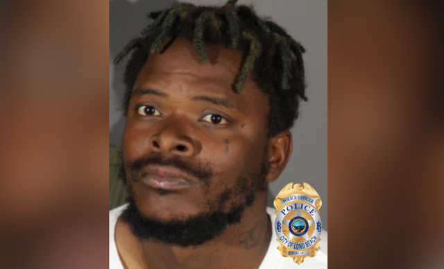 A close-up photo of the face of a man with a police logo in the corner.