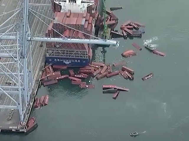 Containers floating around a freighter.