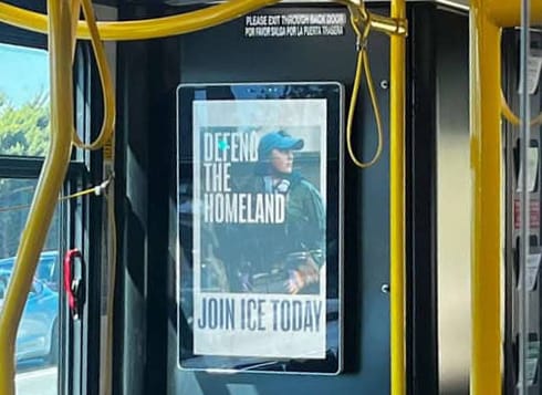 Ad mounted in a public bus that says "Defend the homeland" and "join Ice today."